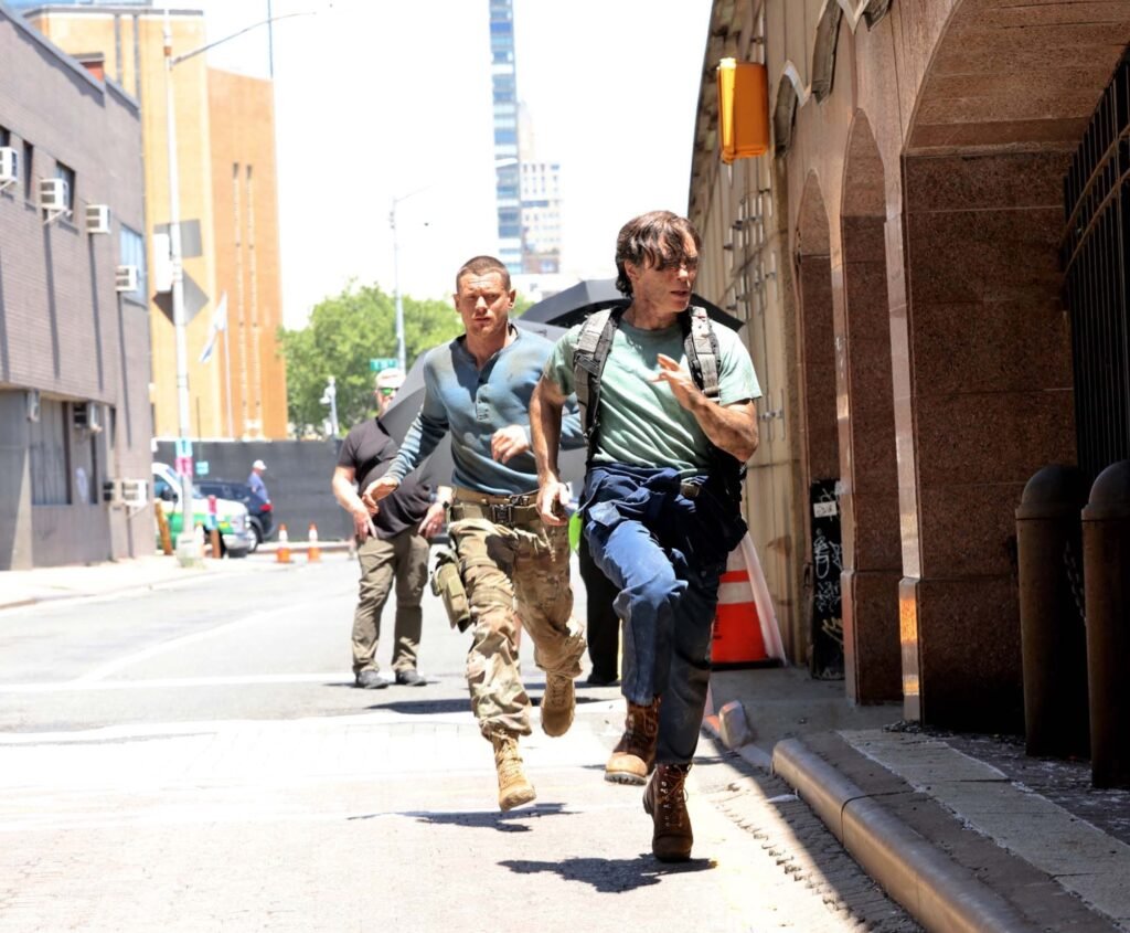 A Quiet Place Part III (2027) behind-the-scenes production photo of Cillian Murphy and Jack O'Connell filming on set in New York City