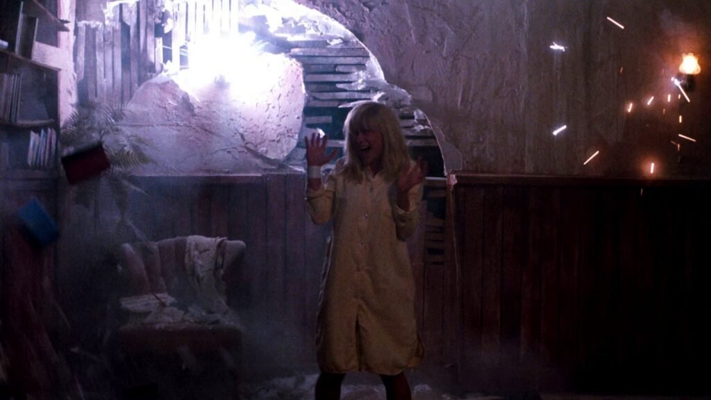 Kristen Parker (Patricia Arquette), bandaged wrist raised, as the dream world closes in during A Nightmare on Elm Street 3: Dream Warriors (1987)