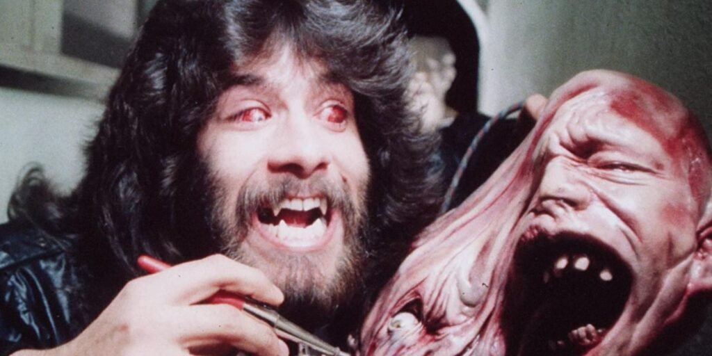 Rob Bottin, special effects artist, airbrushing a creature