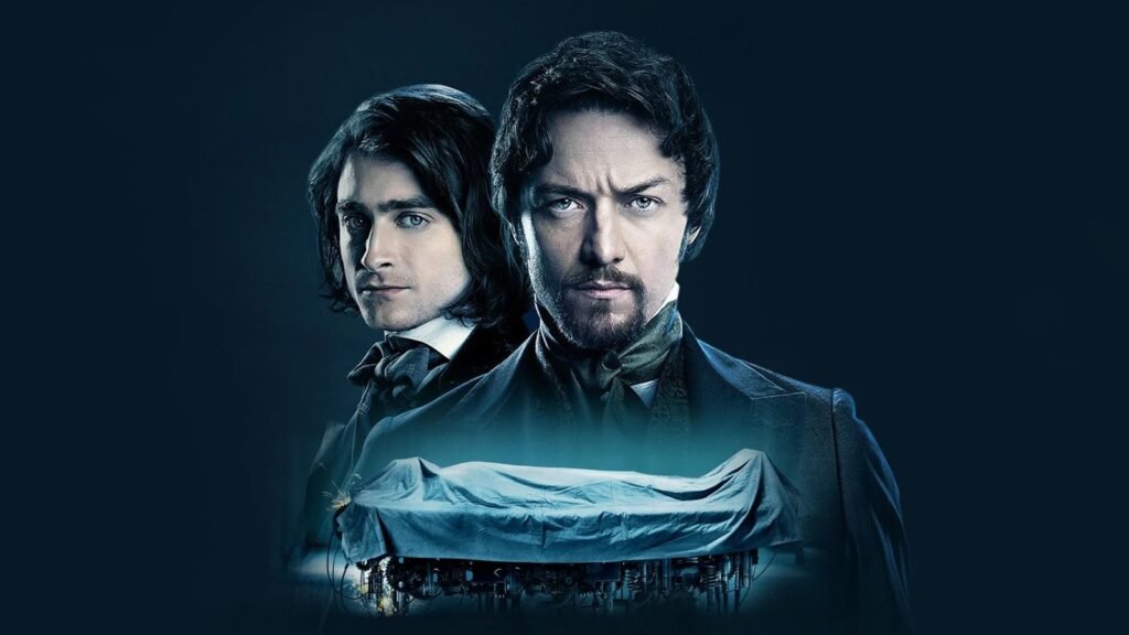Official key art for Victor Frankenstein (2015): James McAvoy as Victor Frankenstein and Daniel Radcliffe as Igor above the shrouded body on the creation table